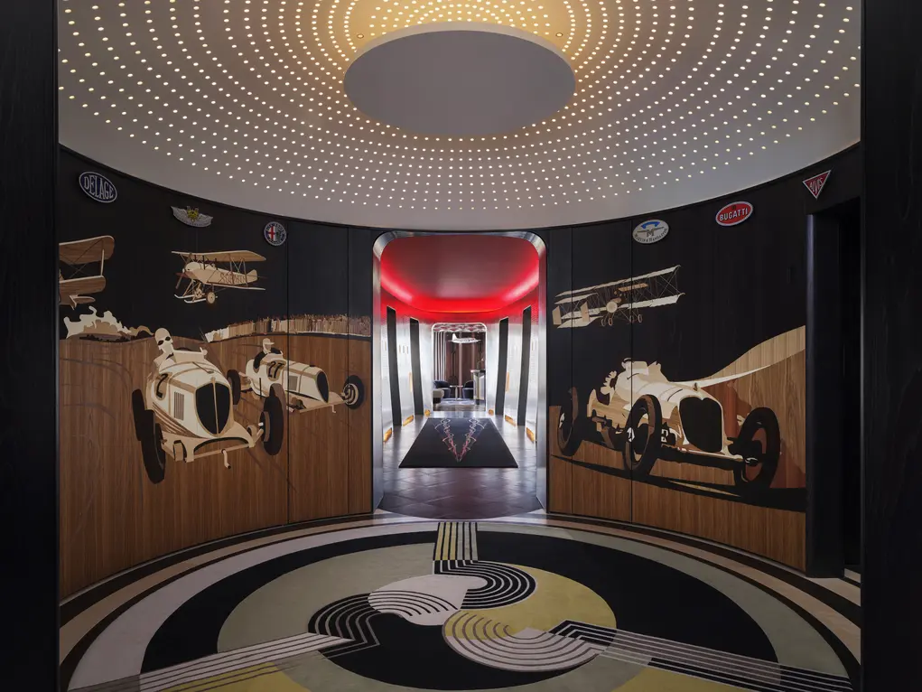 Entrance to Brooklands restaurant with motor car images on the walls